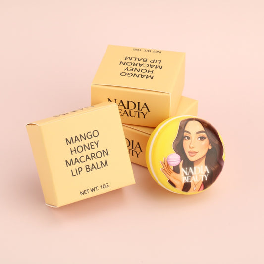 Nadia Beauty Mango Honey Macaron Lip Balm packaging on a pink background